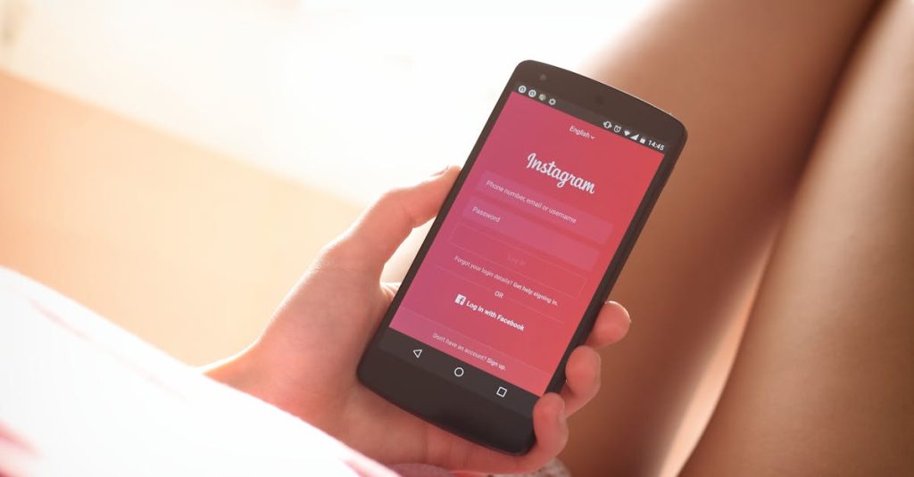 Woman holding a smartphone with Instagram login screen while relaxing indoors.